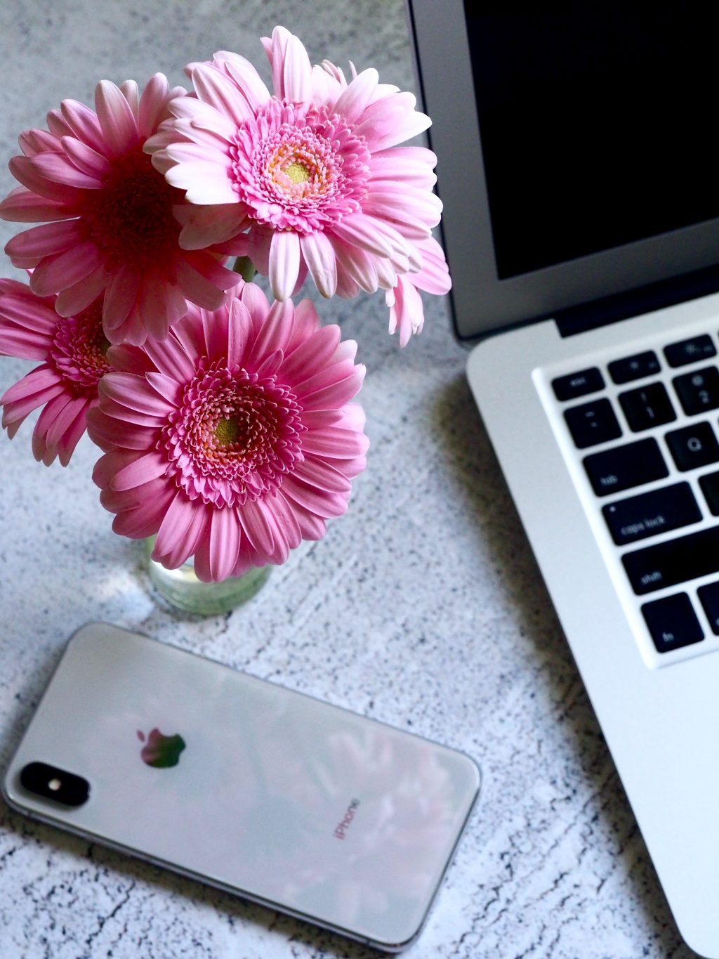 phone and laptop with flowers